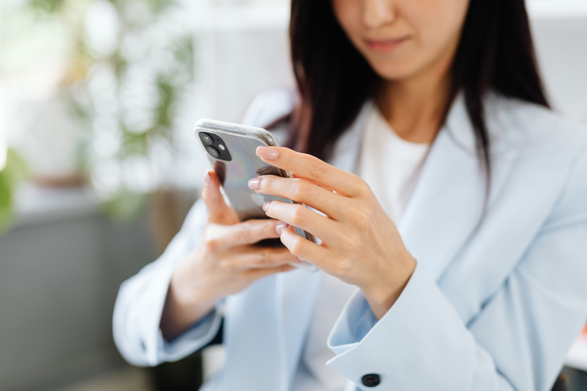 Resident using Qey Hub on her phone at home